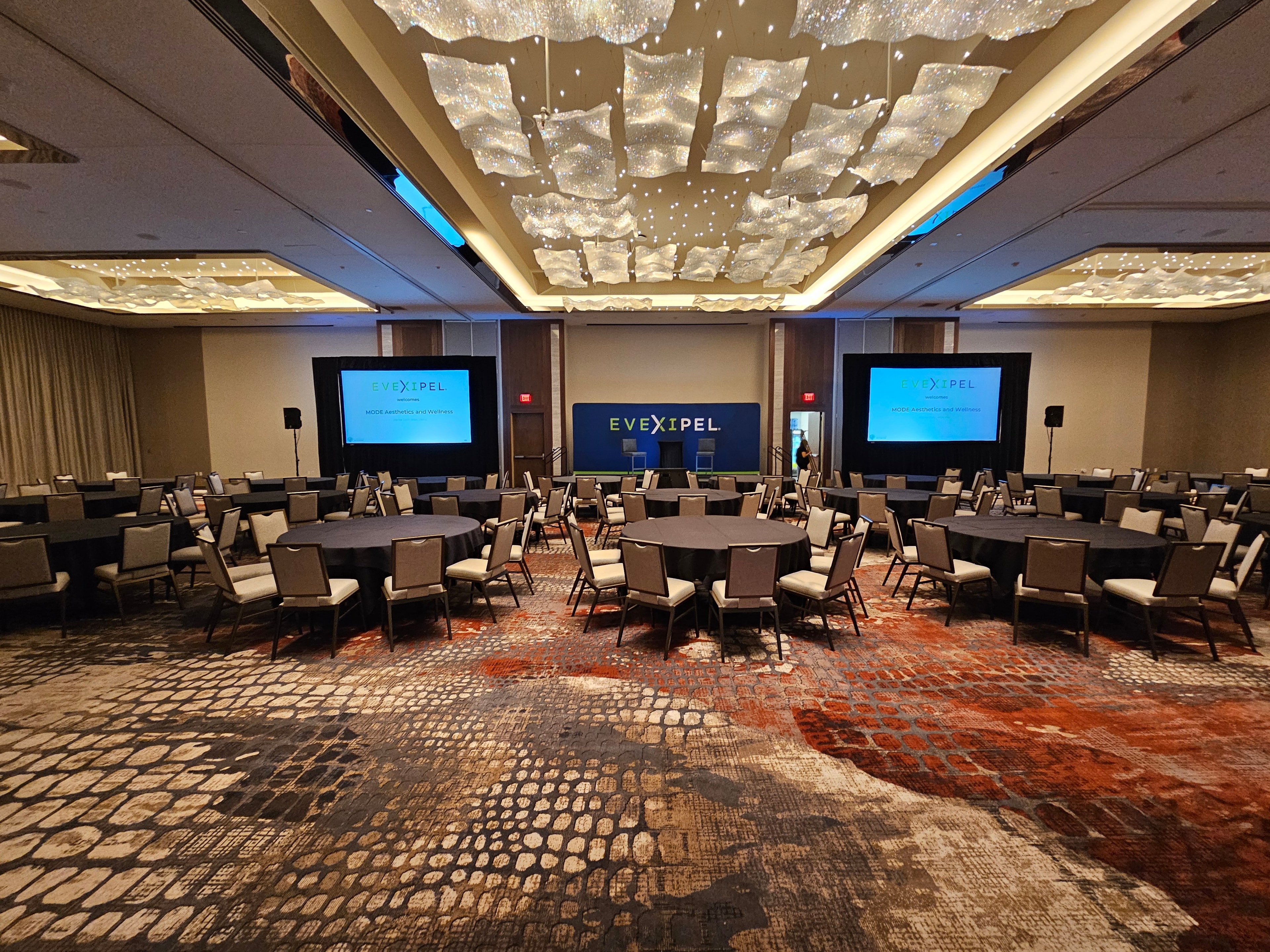 Modern conference ballroom with large display screens