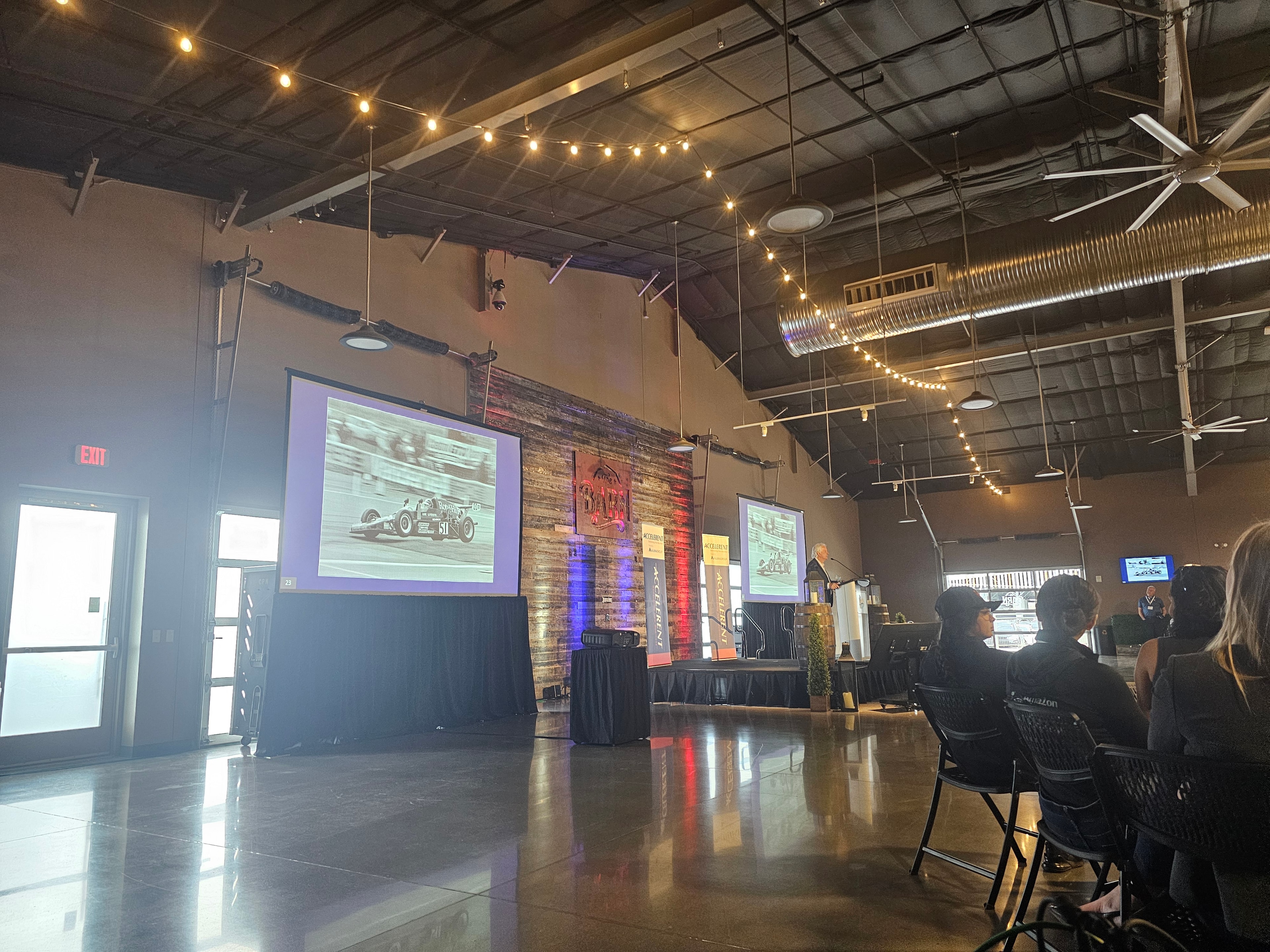 Event space with projection screens and string lights