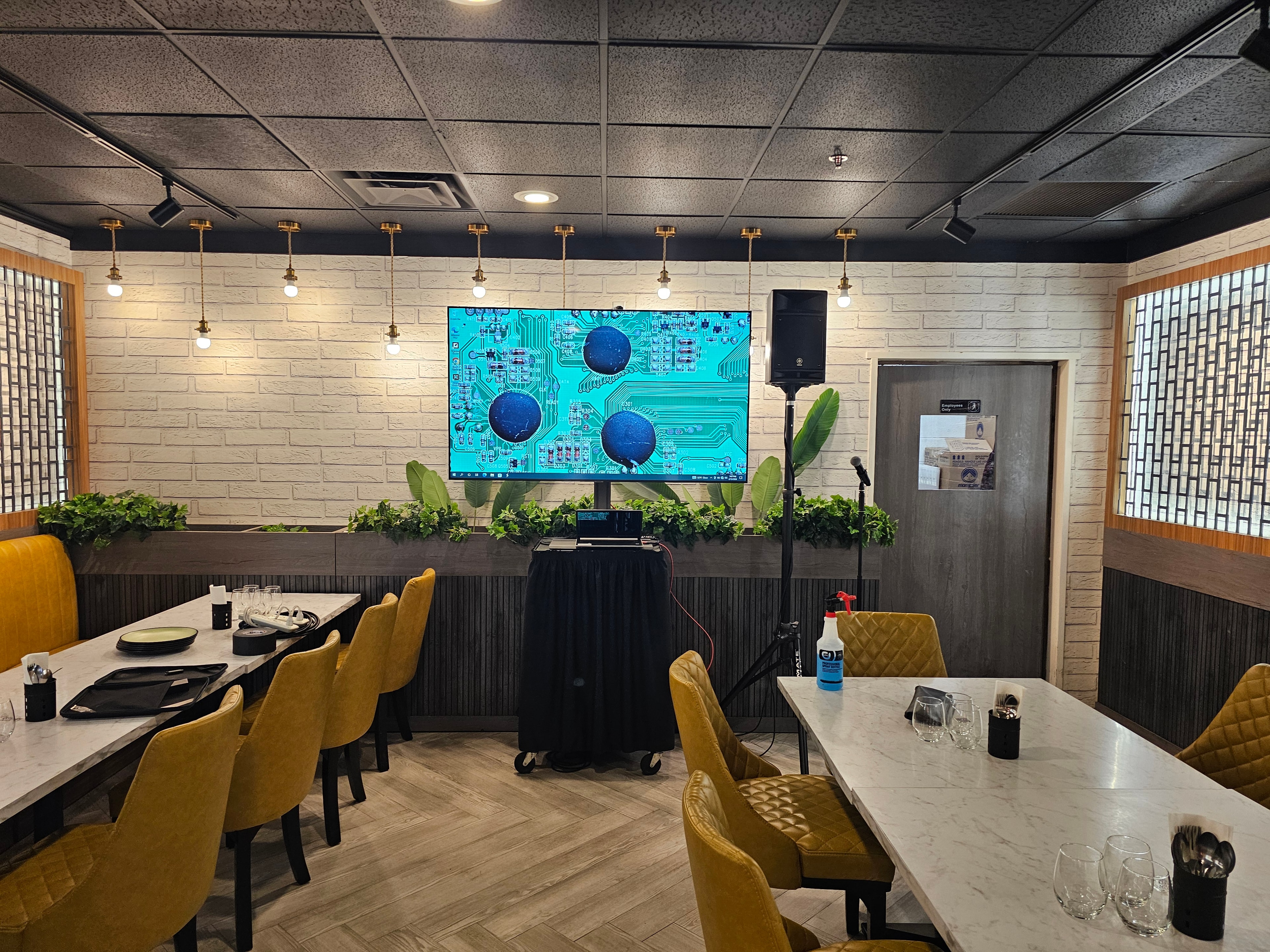 Modern restaurant dining room with digital display