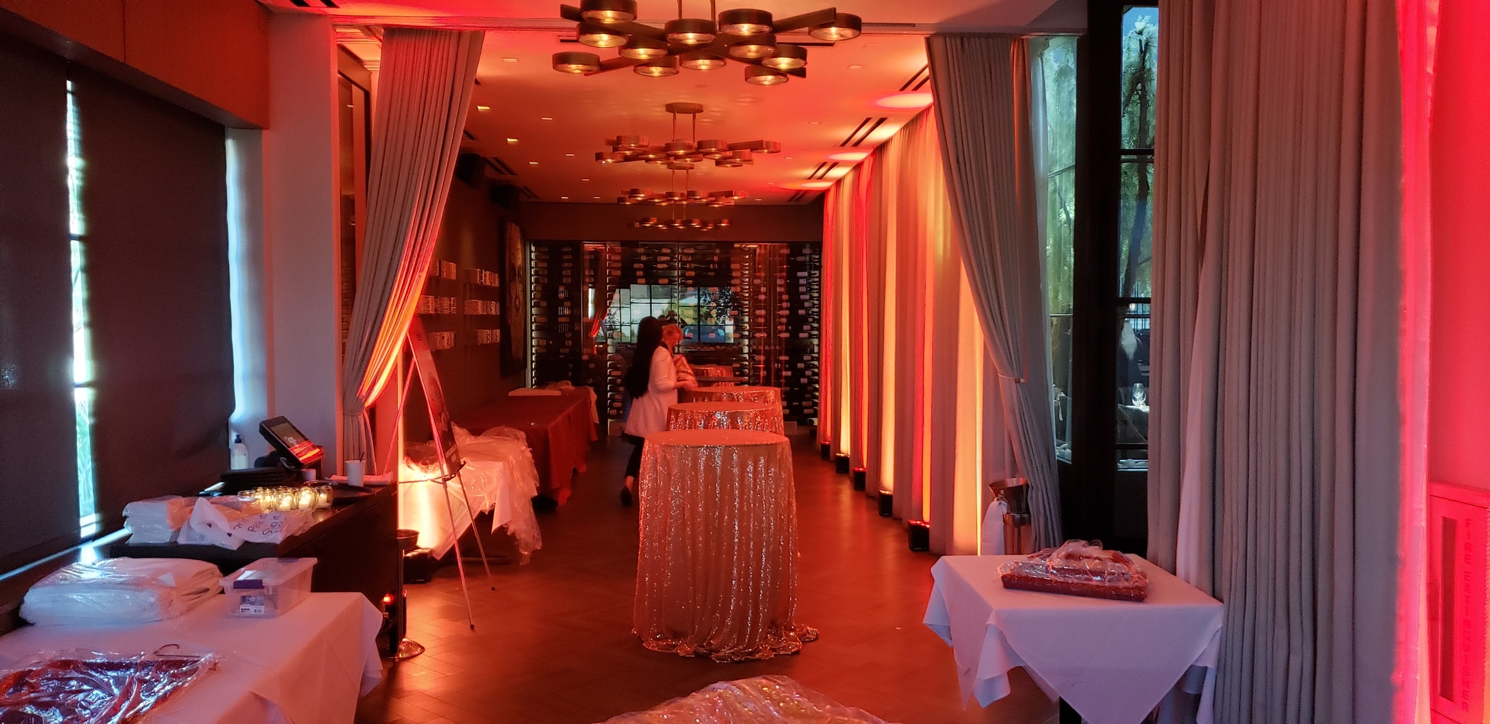 Modern event space with red neon uplighting