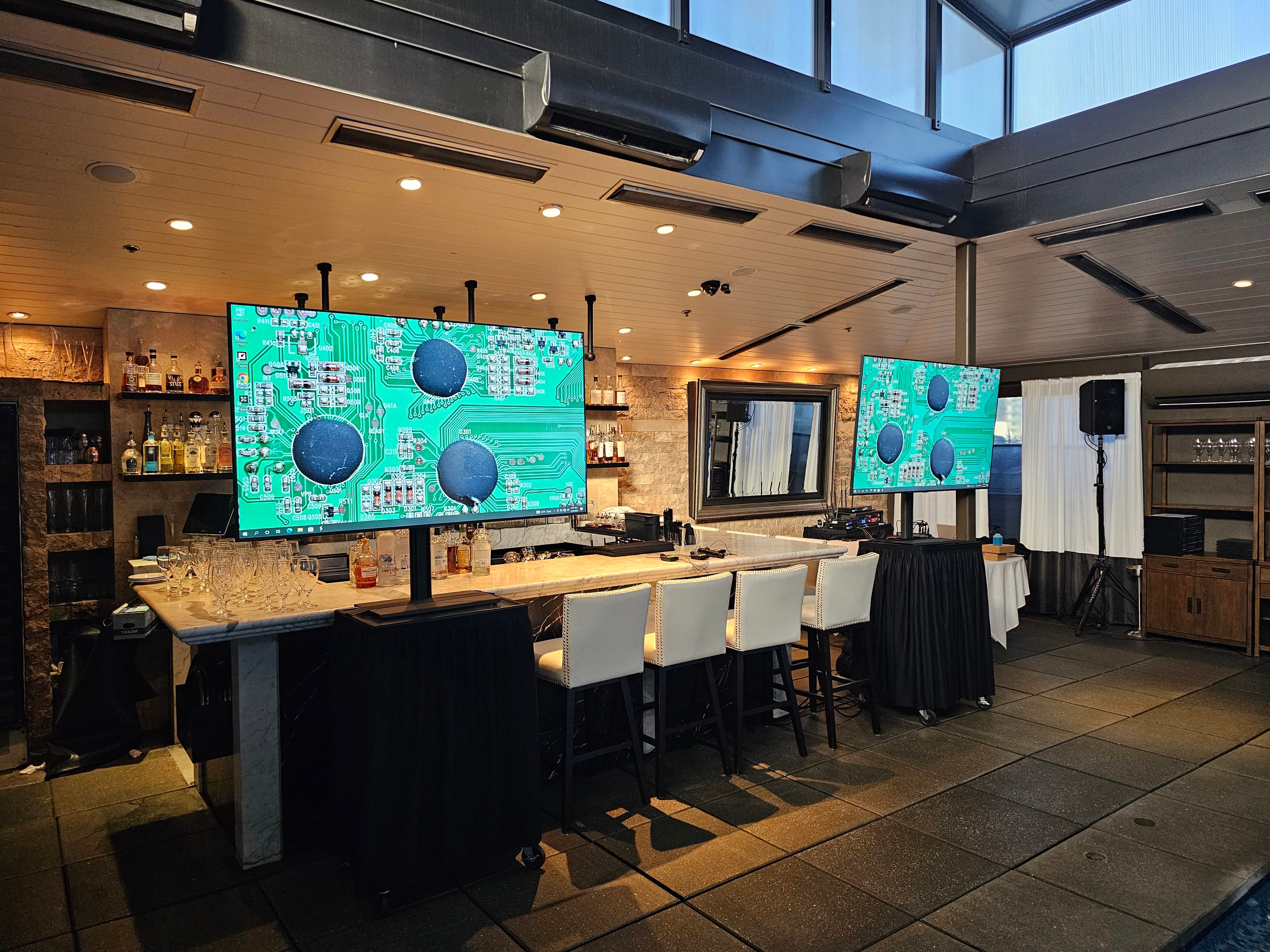Modern bar lounge with dual large digital displays